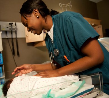 caregiver feeding senior man